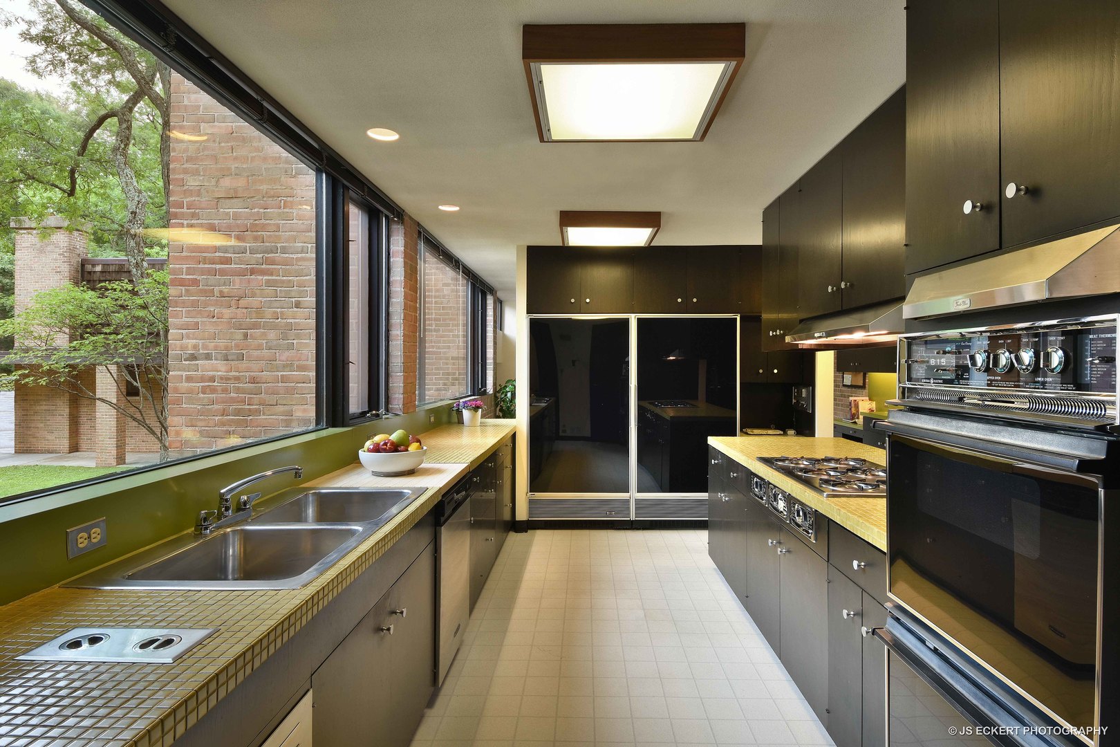 2345 Old Mill Road Lake Forest, IL 60045 - Photo 19 of 73 a kitchen with stainless steel appliances granite countertop a sink and a stove