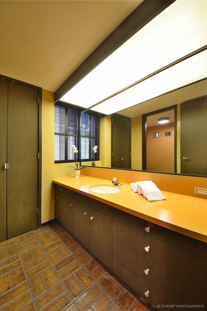 2345 Old Mill Road Lake Forest, IL 60045 - Photo 26 of 73 a bathroom with a granite countertop sink and a large mirror