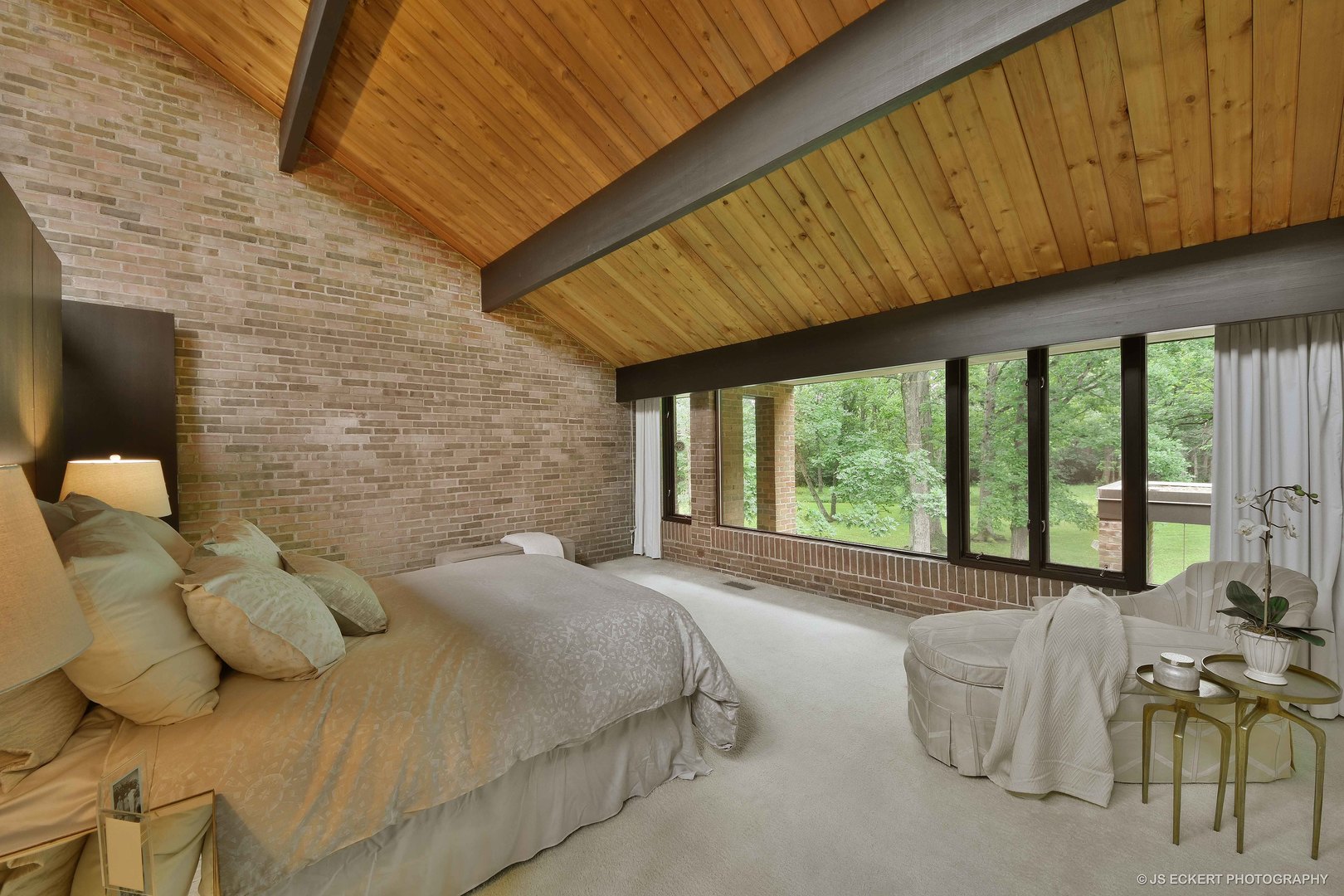 2345 Old Mill Road Lake Forest, IL 60045 - Photo 28 of 73 a spacious bedroom with a bed and large windows