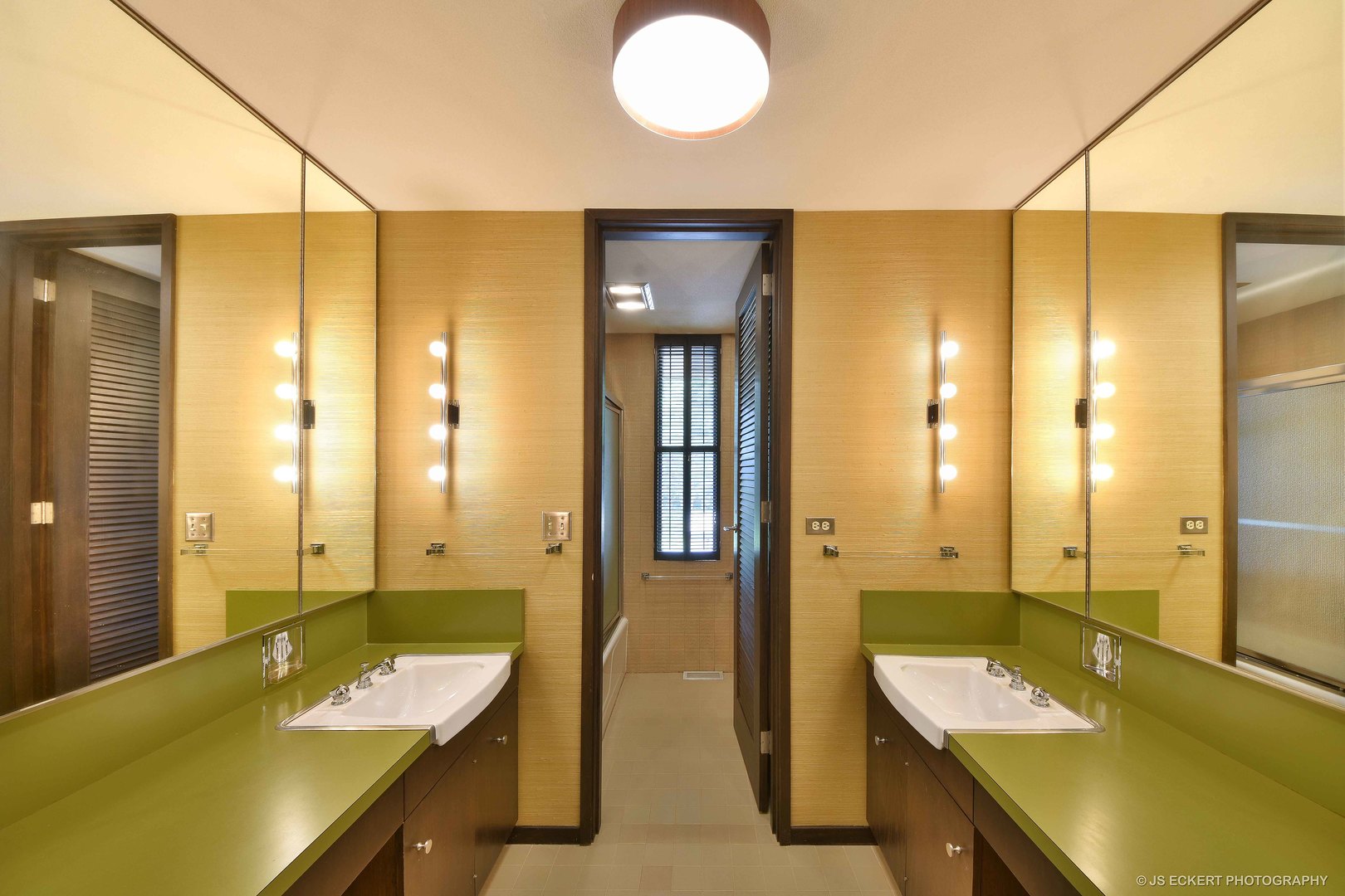 2345 Old Mill Road Lake Forest, IL 60045 - Photo 37 of 73 a bathroom with a tub sink and mirror