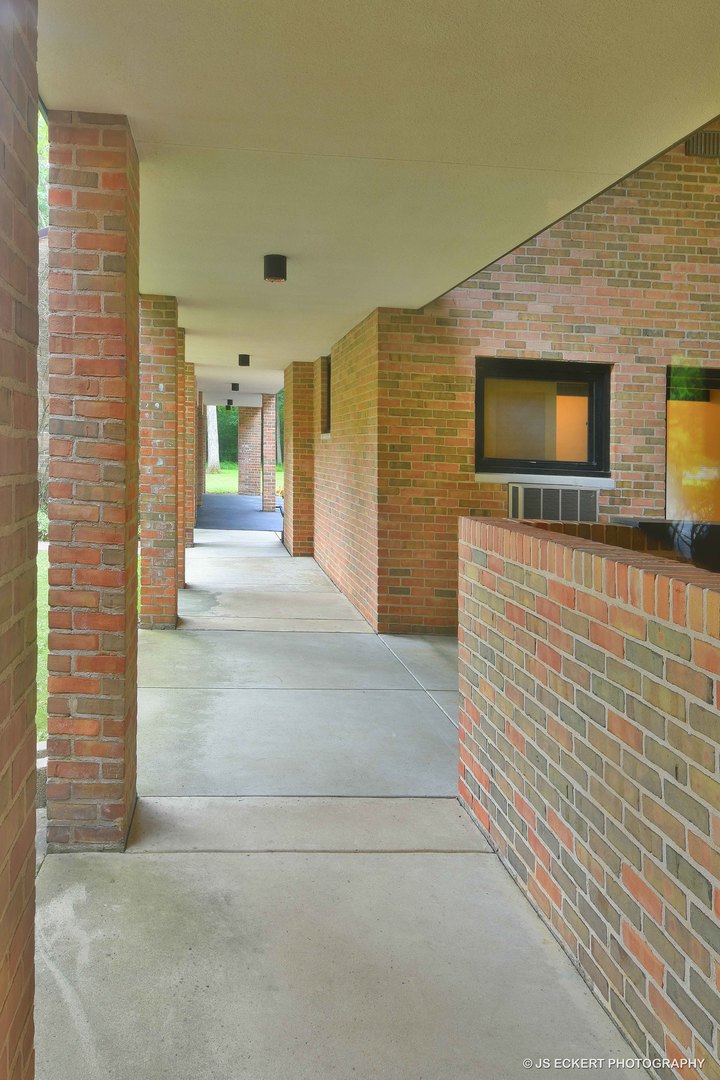 2345 Old Mill Road Lake Forest, IL 60045 - Photo 47 of 73 a view of a hallway with wooden floor and a flat screen tv