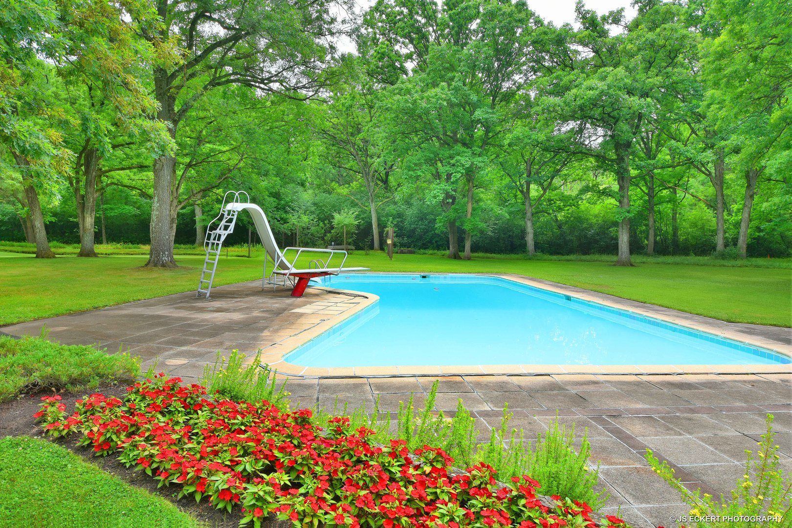 2345 Old Mill Road Lake Forest, IL 60045 - Photo 58 of 73 a small garden with lots of flowers and trees
