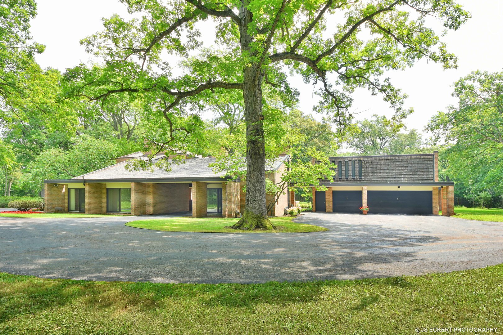 2345 Old Mill Road Lake Forest, IL 60045 - Photo 65 of 73 a front view of a house with a yard and garage
