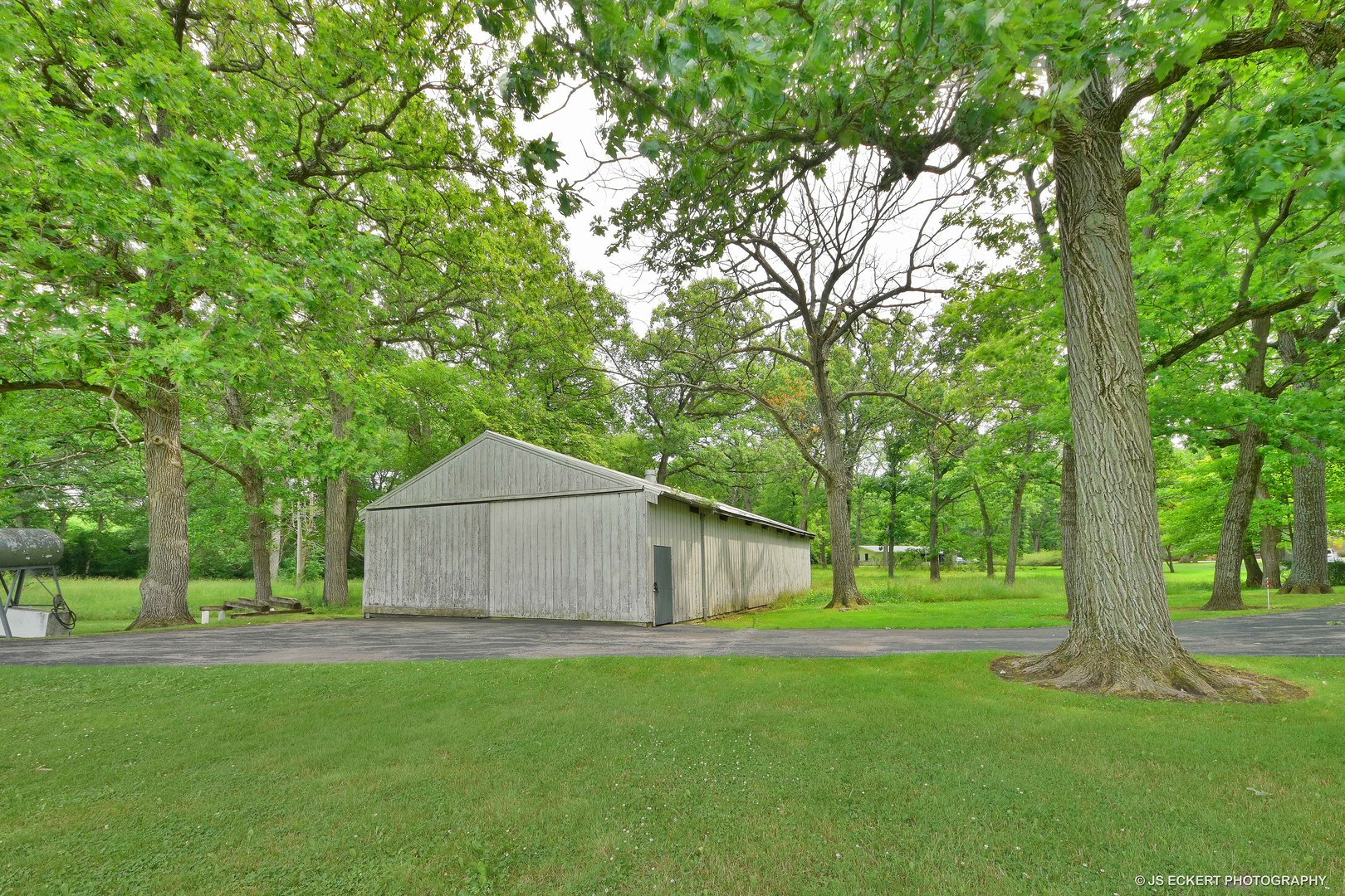 2345 Old Mill Road Lake Forest, IL 60045 - Photo 68 of 73 a front view of a house with a garden and trees