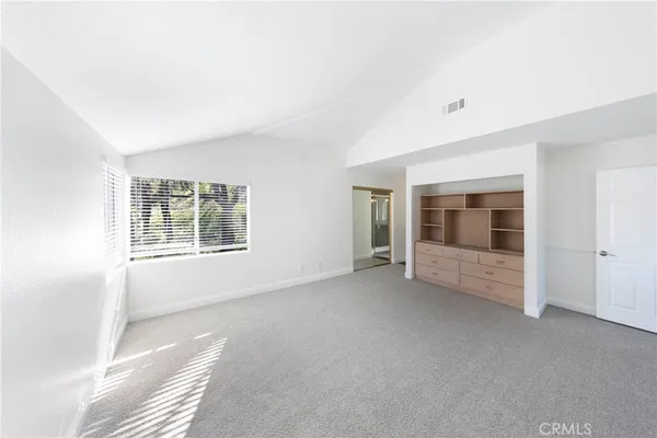 a bathroom with a double vanity sink mirror and shower