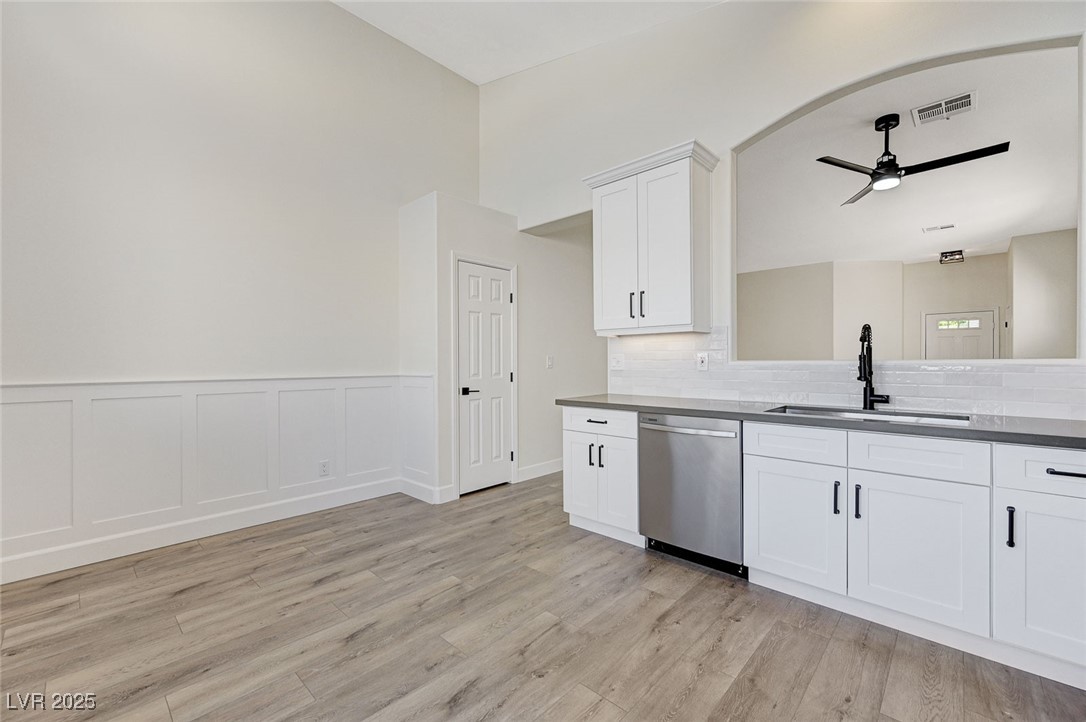 1995 Thunder Ridge Circle Henderson, NV 89012 - Photo 17 of 47 Kitchen featuring a sink, a ceiling fan, dishwasher, visible vents, and light wood-style floors