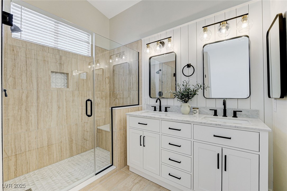 1995 Thunder Ridge Circle Henderson, NV 89012 - Photo 23 of 47 Bathroom with double vanity, a sink, and a stall shower