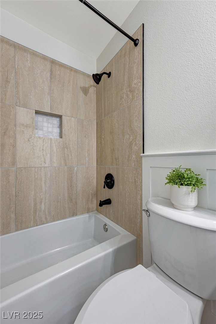 1995 Thunder Ridge Circle Henderson, NV 89012 - Photo 34 of 47 Full bath featuring a textured wall, toilet, and shower / bath combination