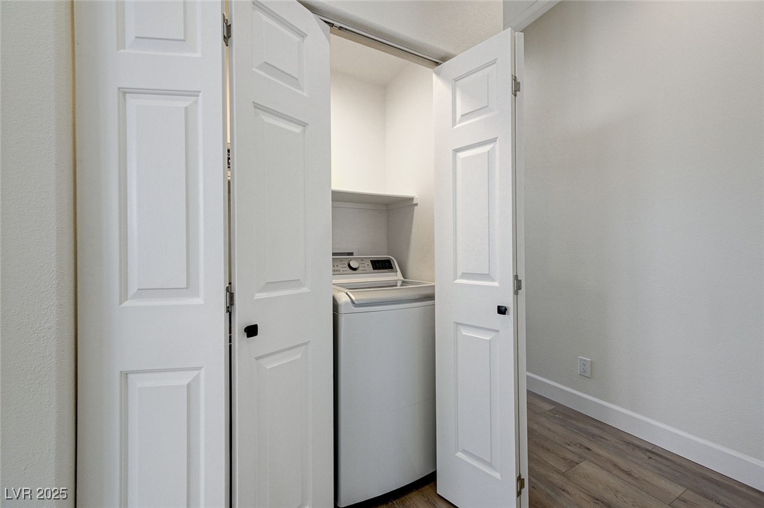 1995 Thunder Ridge Circle Henderson, NV 89012 - Photo 38 of 47 Washroom with baseboards, laundry area, dark wood-type flooring, and washer / dryer