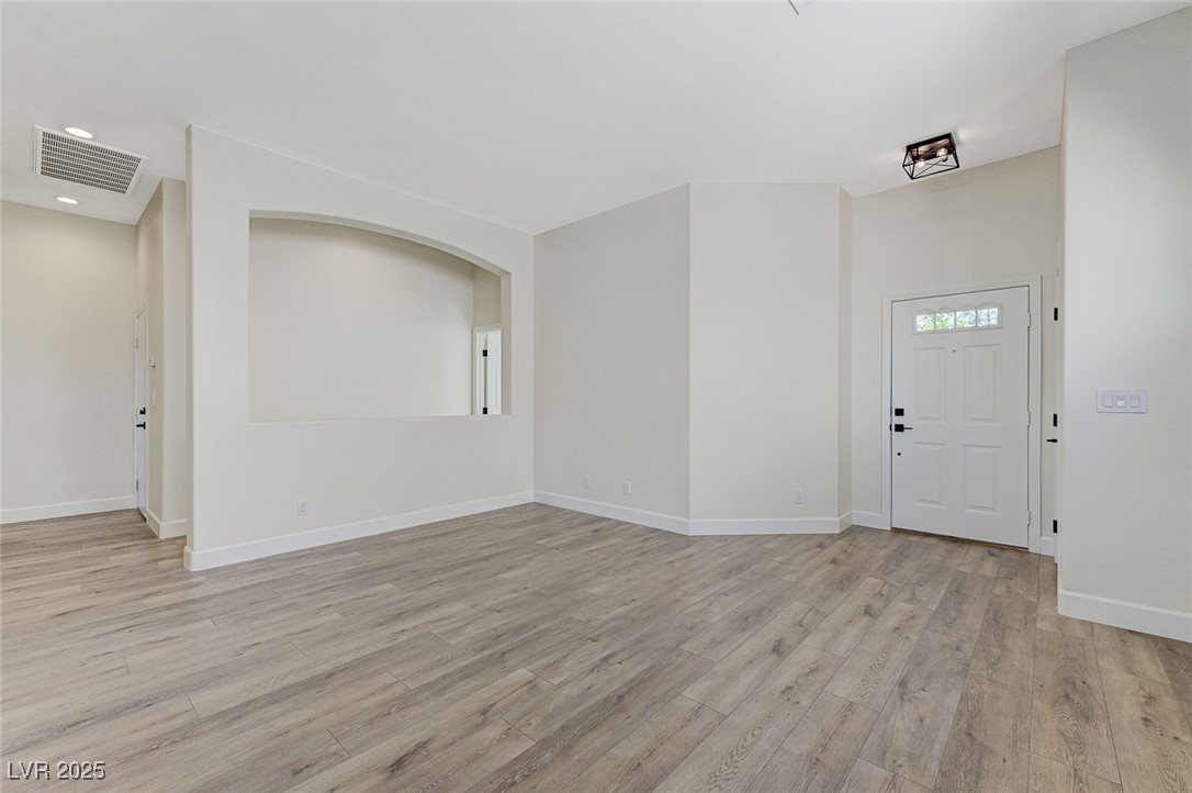 1995 Thunder Ridge Circle Henderson, NV 89012 - Photo 8 of 47 Entryway with baseboards, visible vents, recessed lighting, and light wood-type flooring