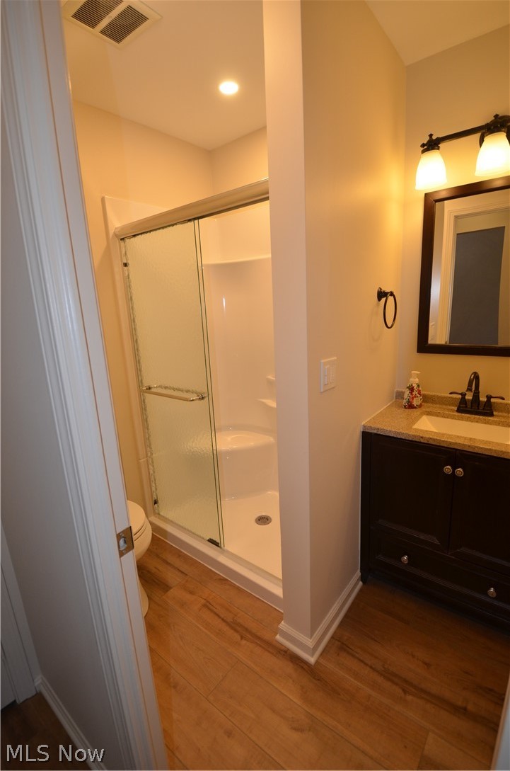 6933 West Fitzwater Road Brecksville, OH 44141 - Photo 16 of 18 Second full bathroom with a shower stall, vanity, and light vinyl floors.