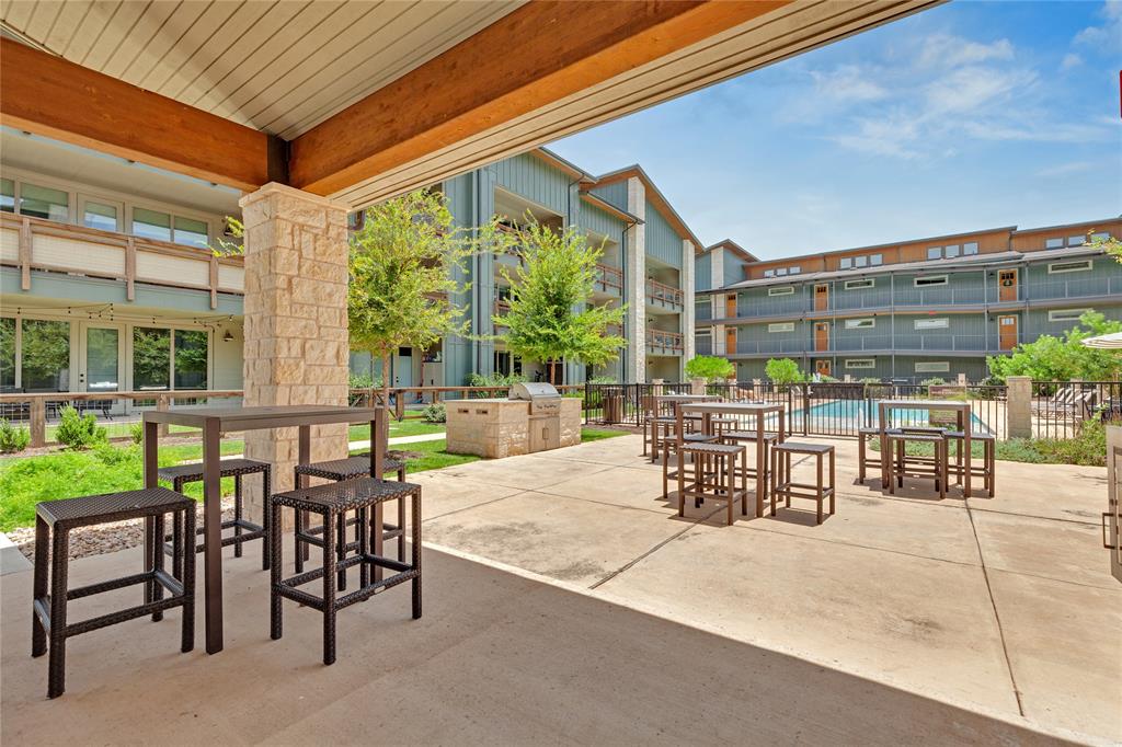 4704 Sunset Trail, Unit 1203 Austin, TX 78745 - Photo 19 of 26 View of patio featuring area for grilling and a community pool