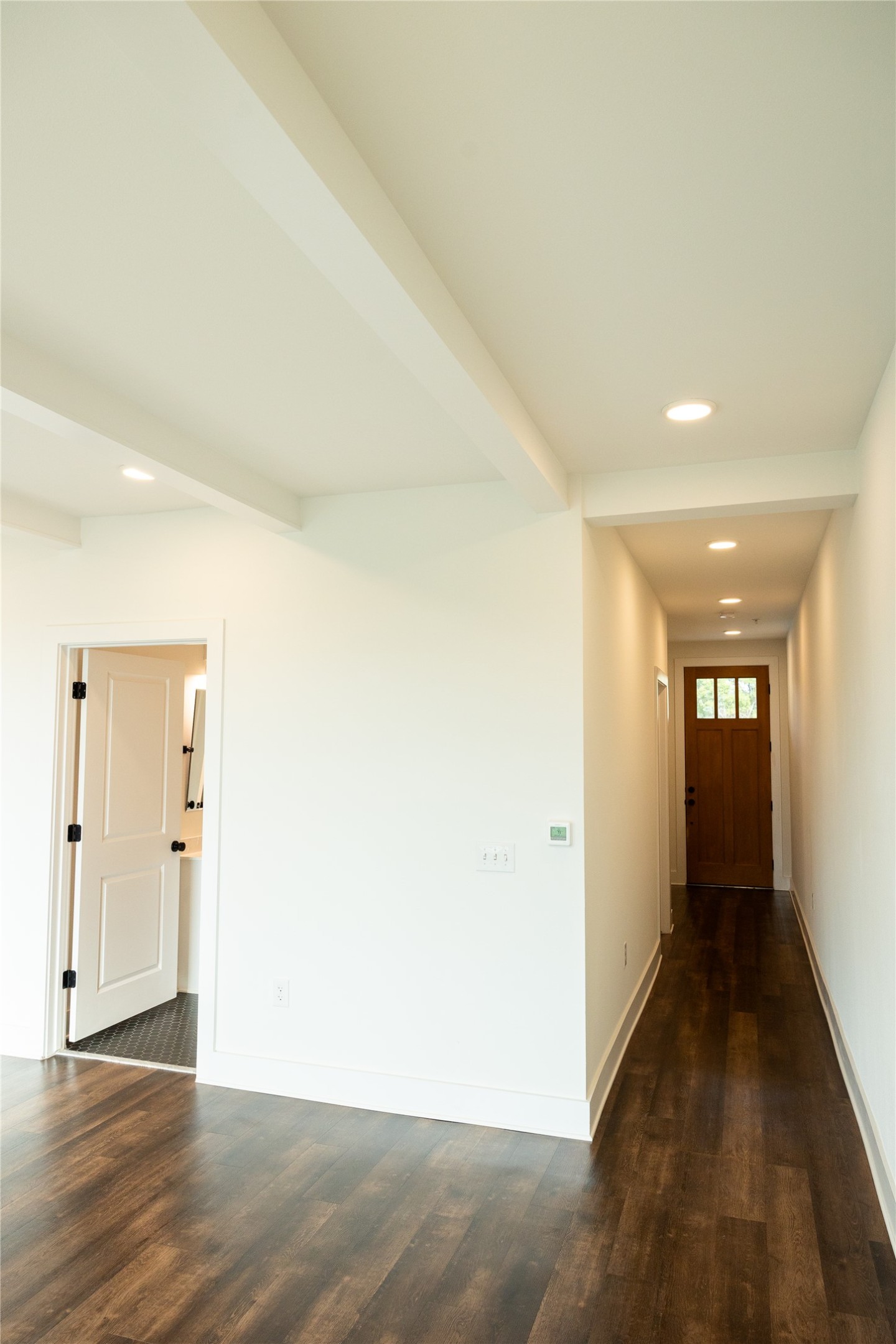 4704 Sunset Trail, Unit 1203 Austin, TX 78745 - Photo 2 of 26 Corridor featuring dark wood-style flooring, recessed lighting, and beamed ceiling