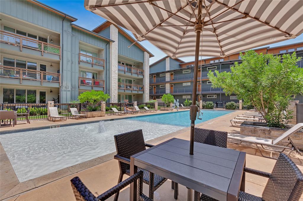 4704 Sunset Trail, Unit 1203 Austin, TX 78745 - Photo 23 of 26 Community pool with a patio and outdoor dining space