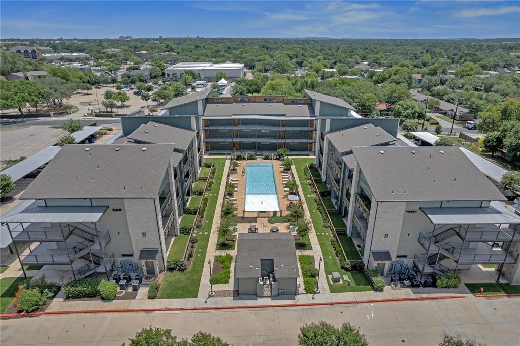 4704 Sunset Trail, Unit 1203 Austin, TX 78745 - Photo 25 of 26 Aerial view of residential area with a pool area and property boundaries highlighted