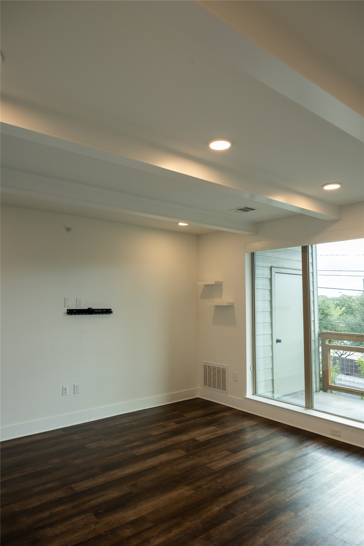 4704 Sunset Trail, Unit 1203 Austin, TX 78745 - Photo 4 of 26 Spare room featuring dark wood finished floors and recessed lighting