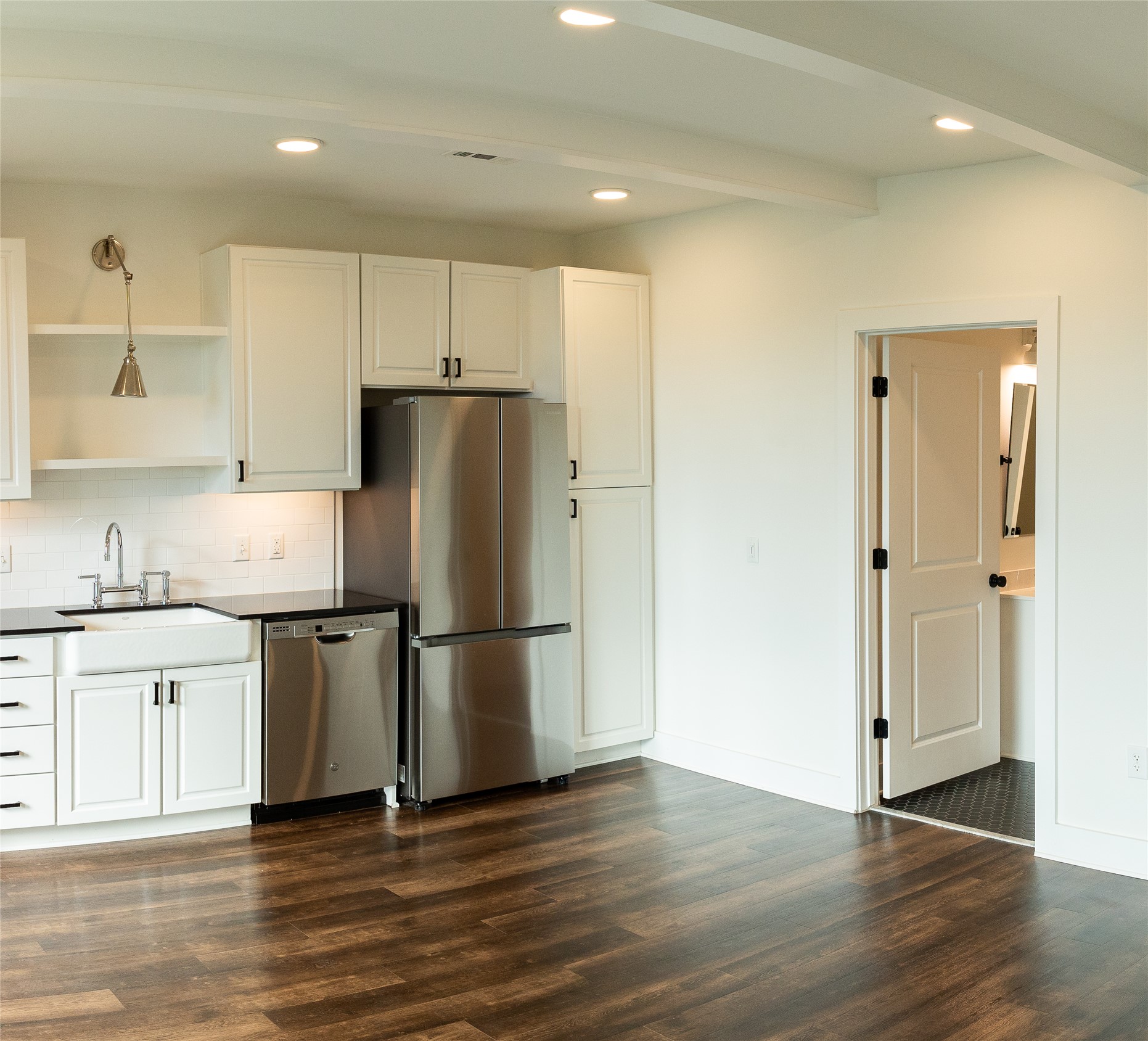 4704 Sunset Trail, Unit 1203 Austin, TX 78745 - Photo 10 of 26 Kitchen with white cabinetry, recessed lighting, open shelves, stainless steel appliances, and dark wood-style floors