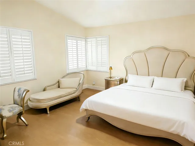 a bedroom with a bed and a couch