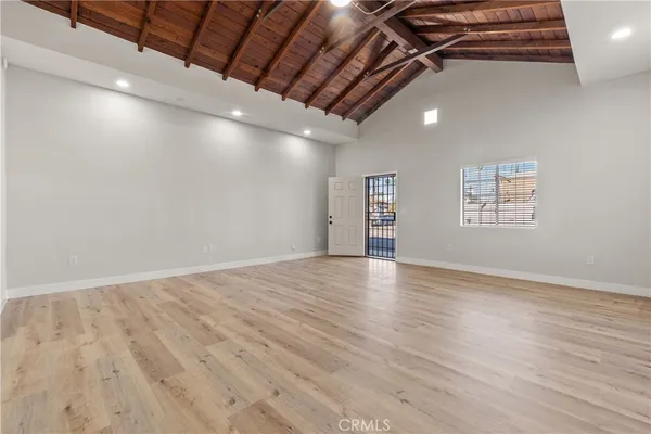 a view of an empty room with windows