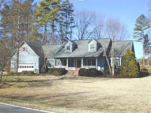 8065 Fairfield Forest Road Denver, NC 28037 - Photo 1 of 8 a front view of a house with a yard
