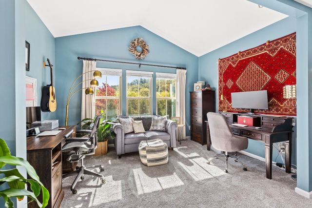 a spacious bathroom with a granite countertop tub sink a mirror a shower and vanity
