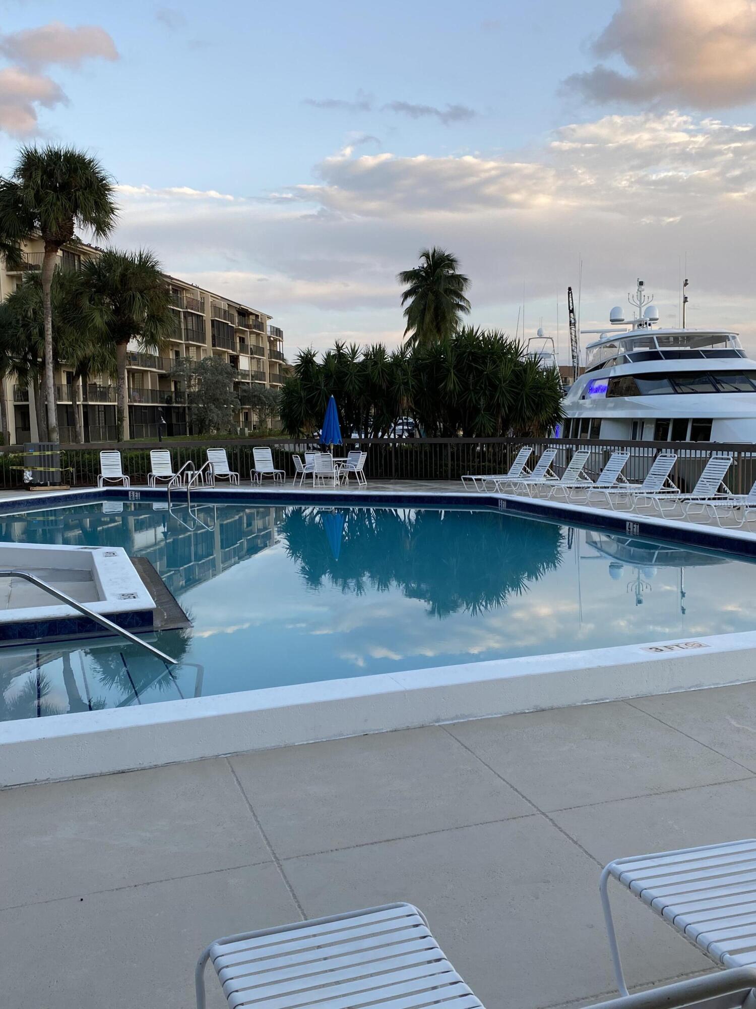 1401 Tidal Pointe Boulevard, Unit 201 Jupiter, FL 33477 - Photo 40 of 45 Pool at twilight