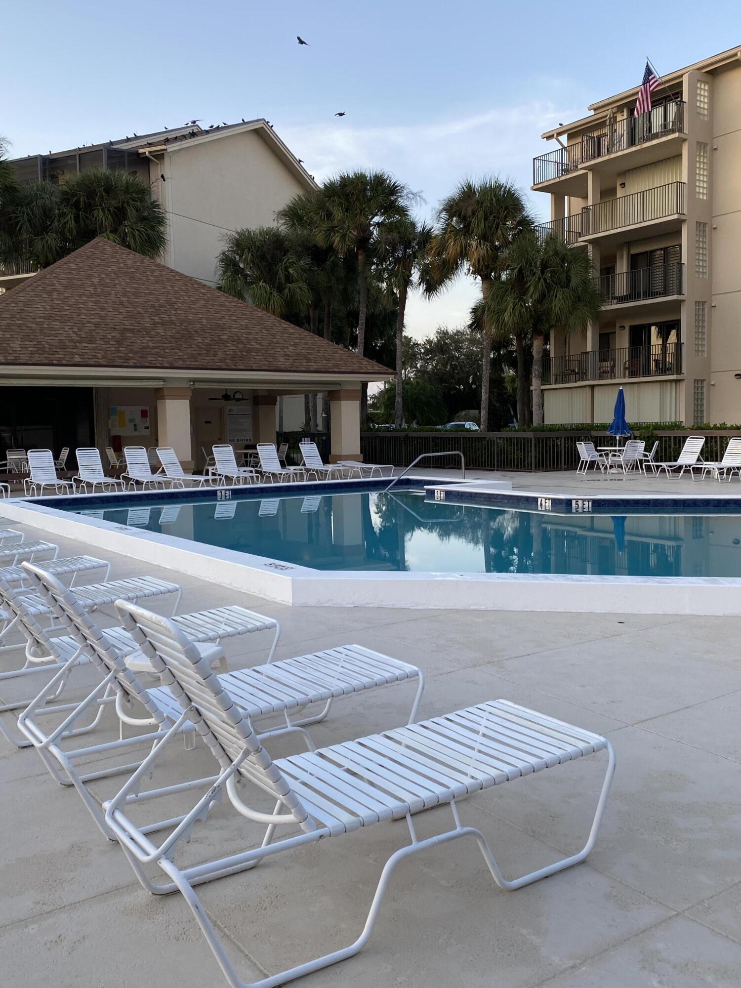 1401 Tidal Pointe Boulevard, Unit 201 Jupiter, FL 33477 - Photo 41 of 45 Pool at twilight 2
