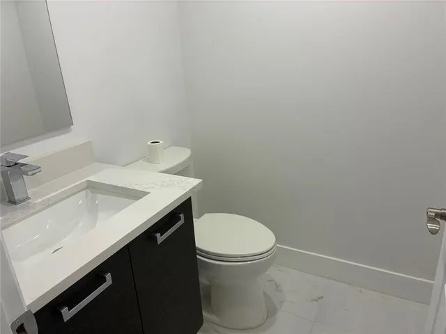 a bathroom with a sink and a toilet