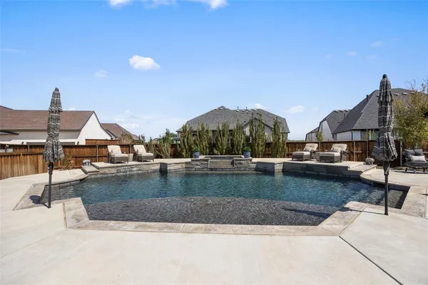 a view of pool with outdoor seating