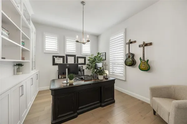 a bathroom with a sink a mirror and window