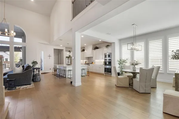 a living room with furniture and large windows