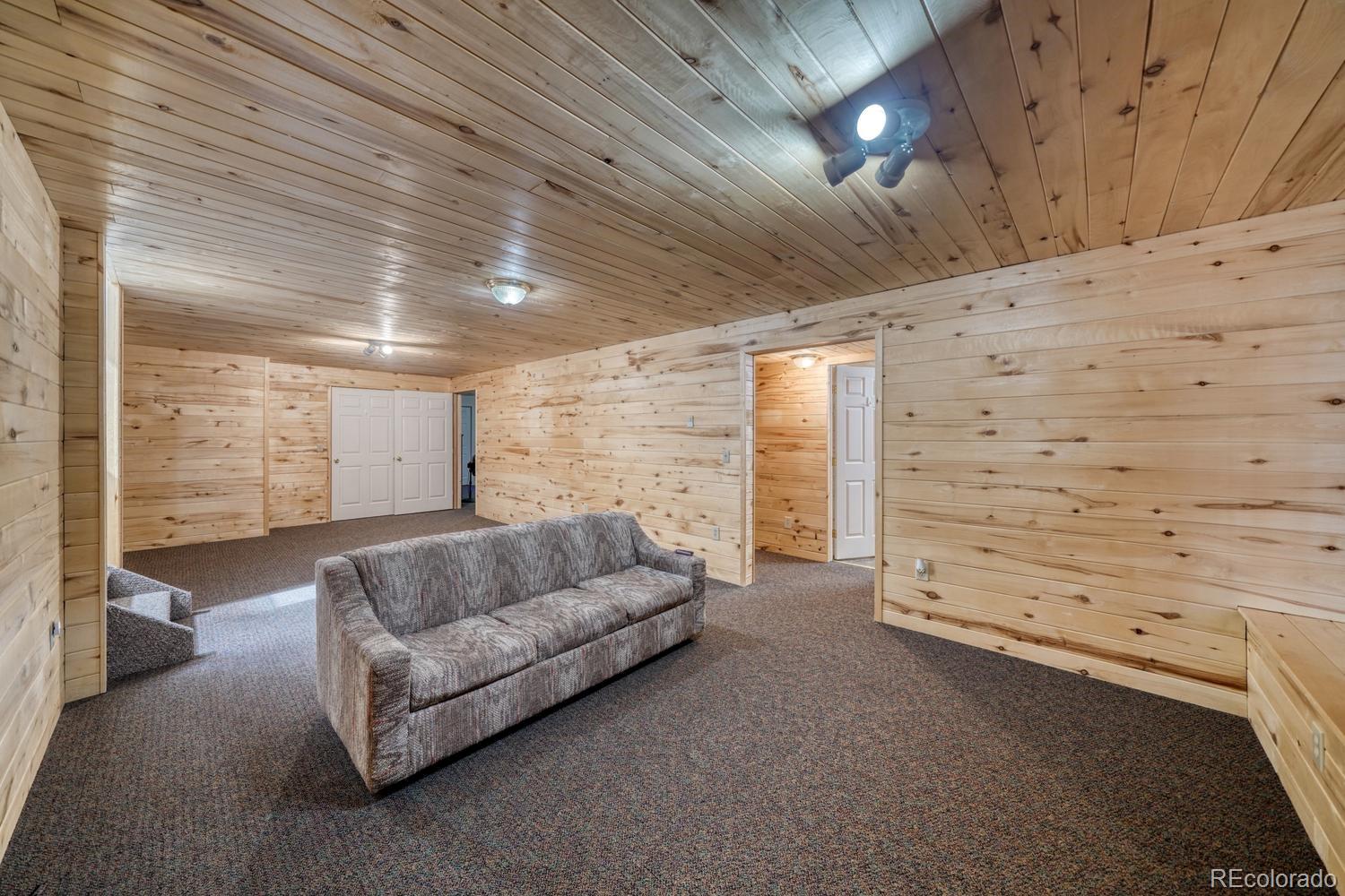 31015 West Ridge Road Buena Vista, CO 81211 - Photo 22 of 48 a living room with furniture and a ceiling fan
