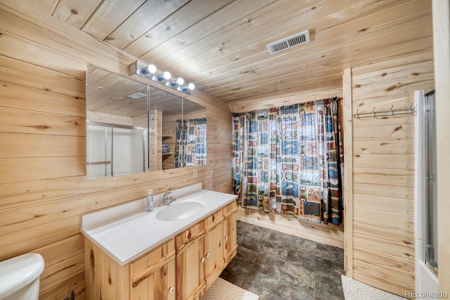 31015 West Ridge Road Buena Vista, CO 81211 - Photo 23 of 48 a bathroom with a sink a toilet and shower