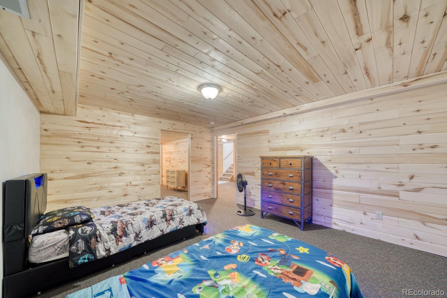 31015 West Ridge Road Buena Vista, CO 81211 - Photo 26 of 48 a bedroom with furniture and a baby crib
