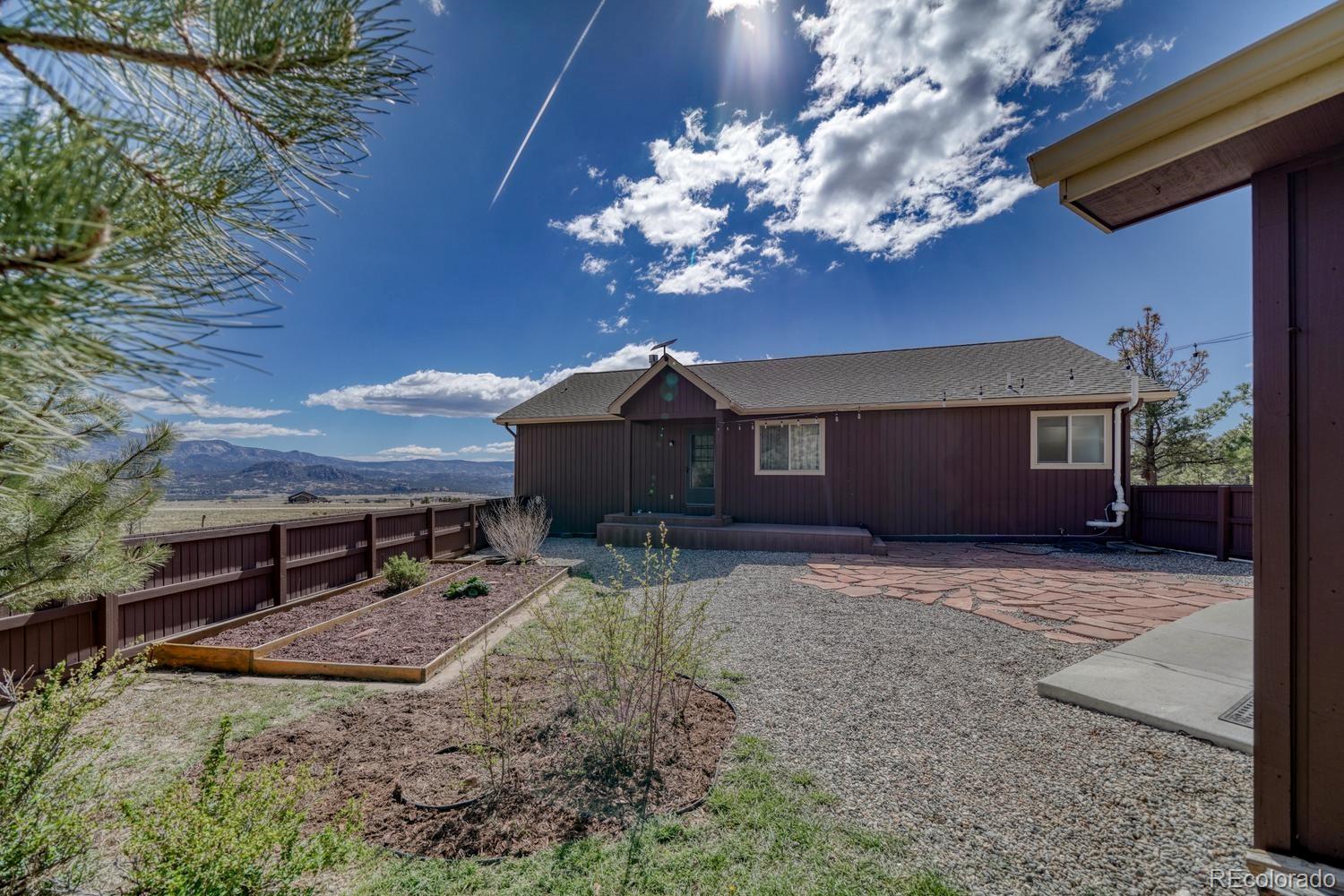 31015 West Ridge Road Buena Vista, CO 81211 - Photo 32 of 48 a front view of a house with a yard