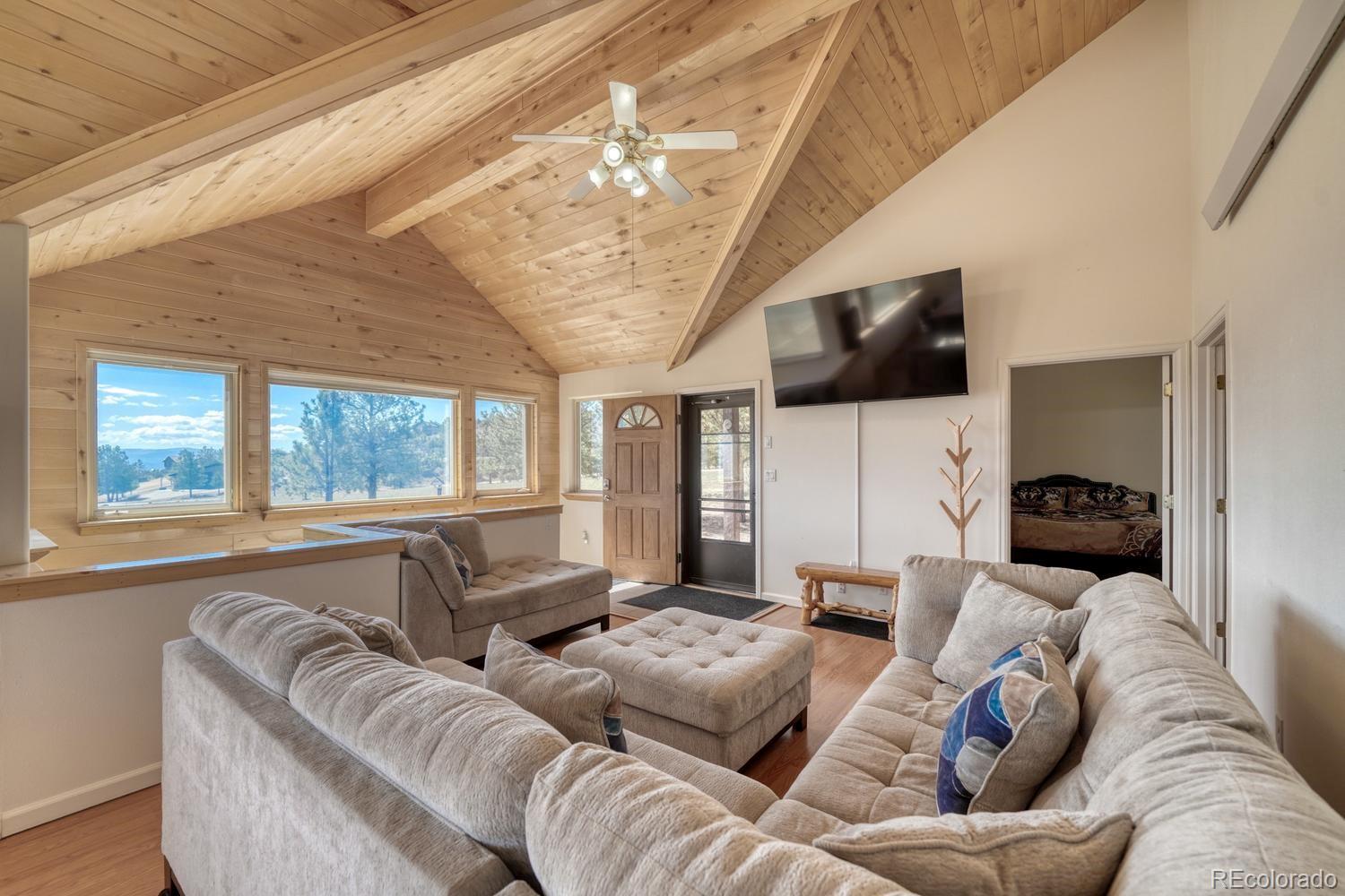 31015 West Ridge Road Buena Vista, CO 81211 - Photo 4 of 48 a living room with furniture and a flat screen tv