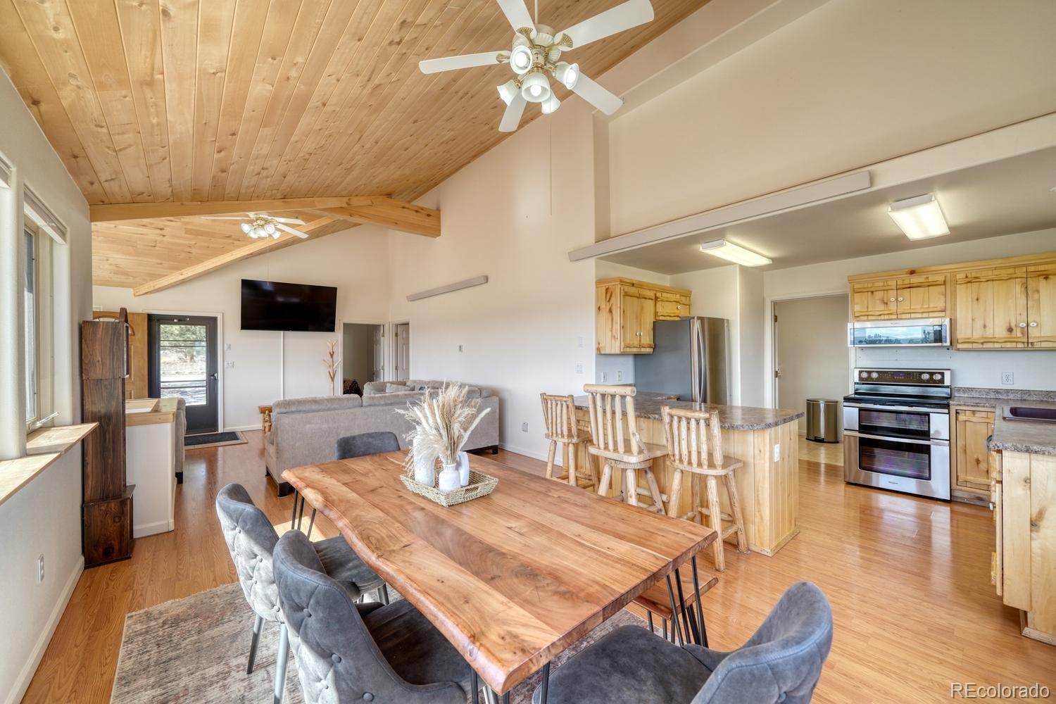 31015 West Ridge Road Buena Vista, CO 81211 - Photo 6 of 48 a view of a dining room with furniture wooden floor and chandelier