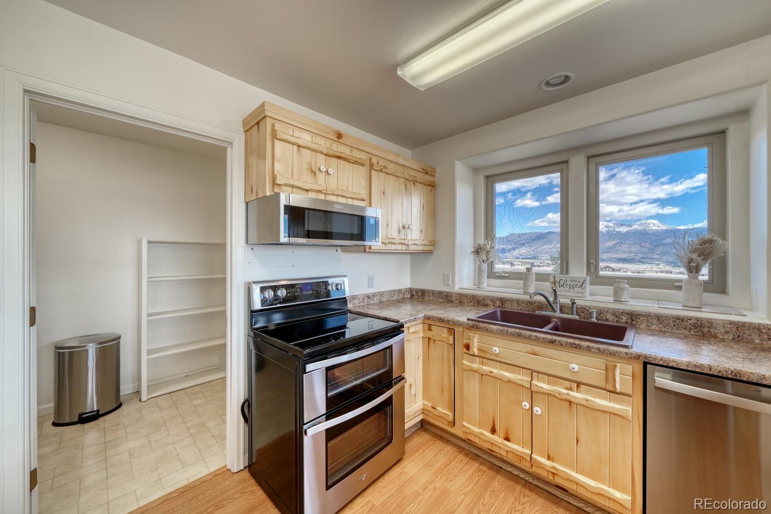 31015 West Ridge Road Buena Vista, CO 81211 - Photo 9 of 48 a kitchen with a sink stove and microwave