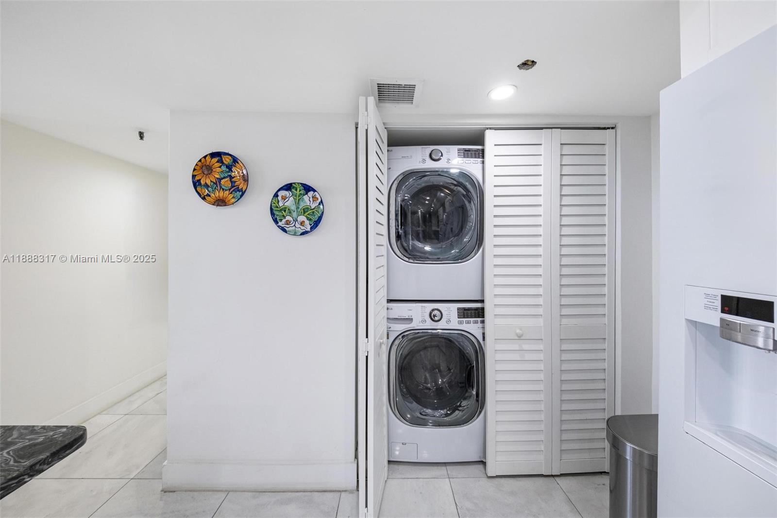 520 Brickell Key Drive, Unit A710 Miami, FL 33131 - Photo 26 of 43 a room with a washer and dryer