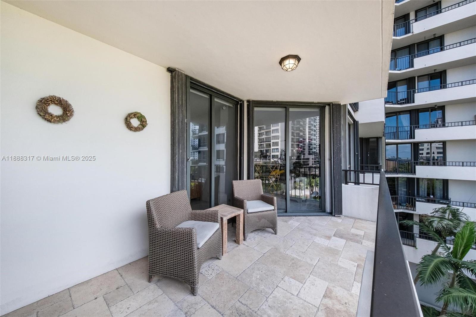 520 Brickell Key Drive, Unit A710 Miami, FL 33131 - Photo 4 of 43 a living room with furniture and a book shelf