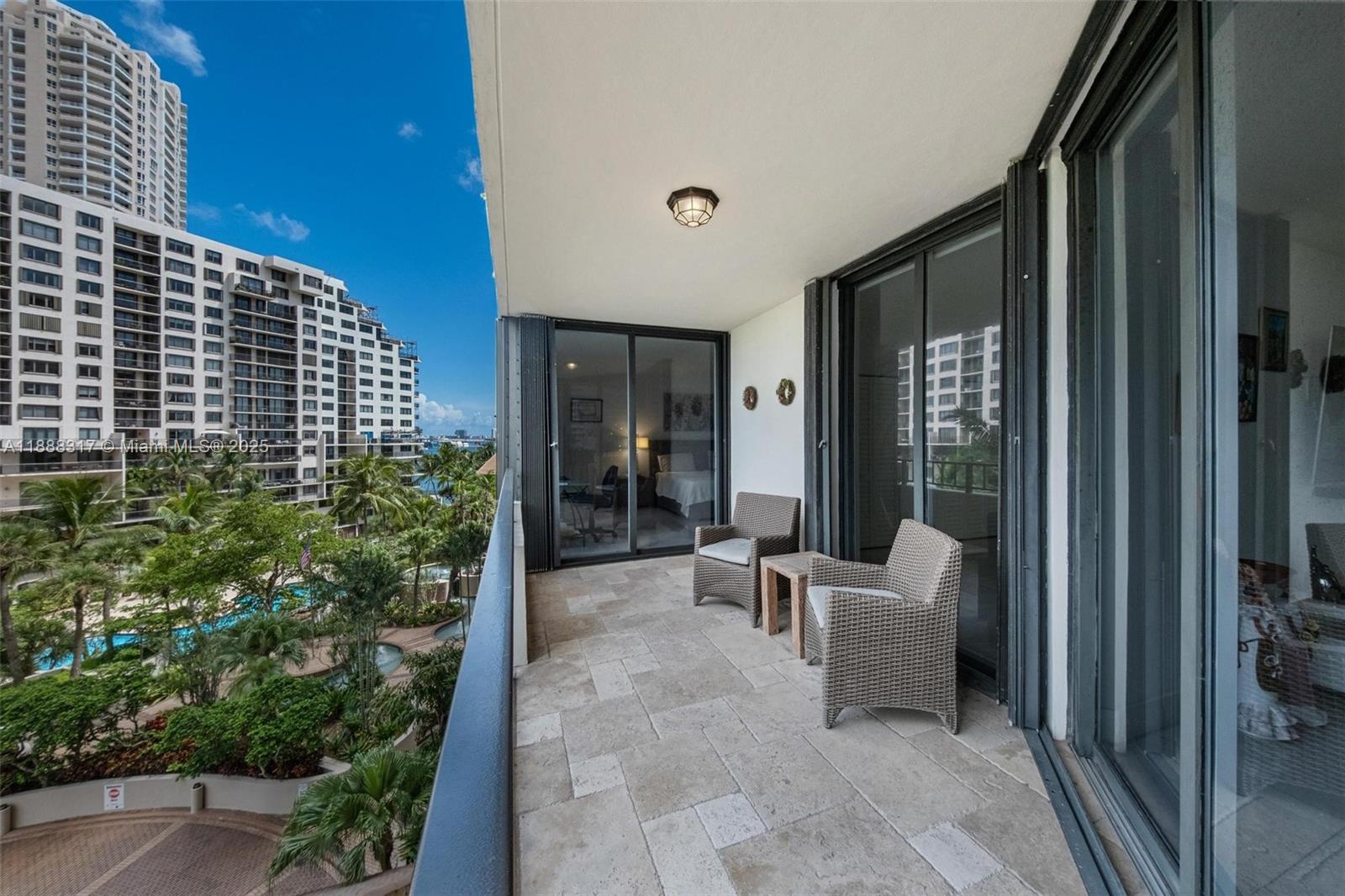 520 Brickell Key Drive, Unit A710 Miami, FL 33131 - Photo 42 of 43 a balcony with furniture and outdoor space
