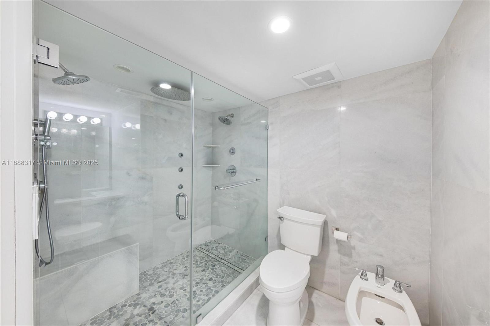 520 Brickell Key Drive, Unit A710 Miami, FL 33131 - Photo 10 of 43 a bathroom with a shower toilet and sink