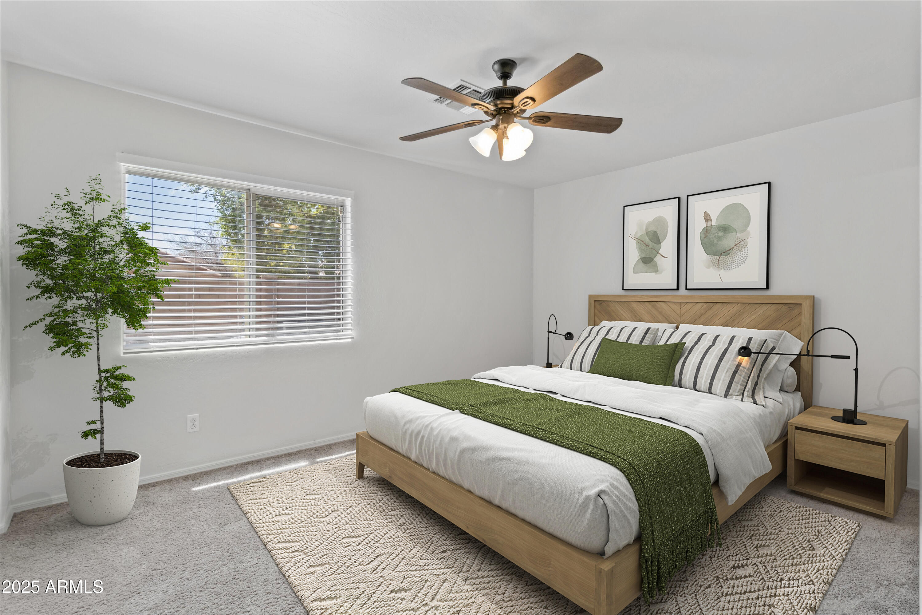 11921 West Bloomfield Road El Mirage, AZ 85335 - Photo 13 of 24 a bedroom with a bed and a potted plant