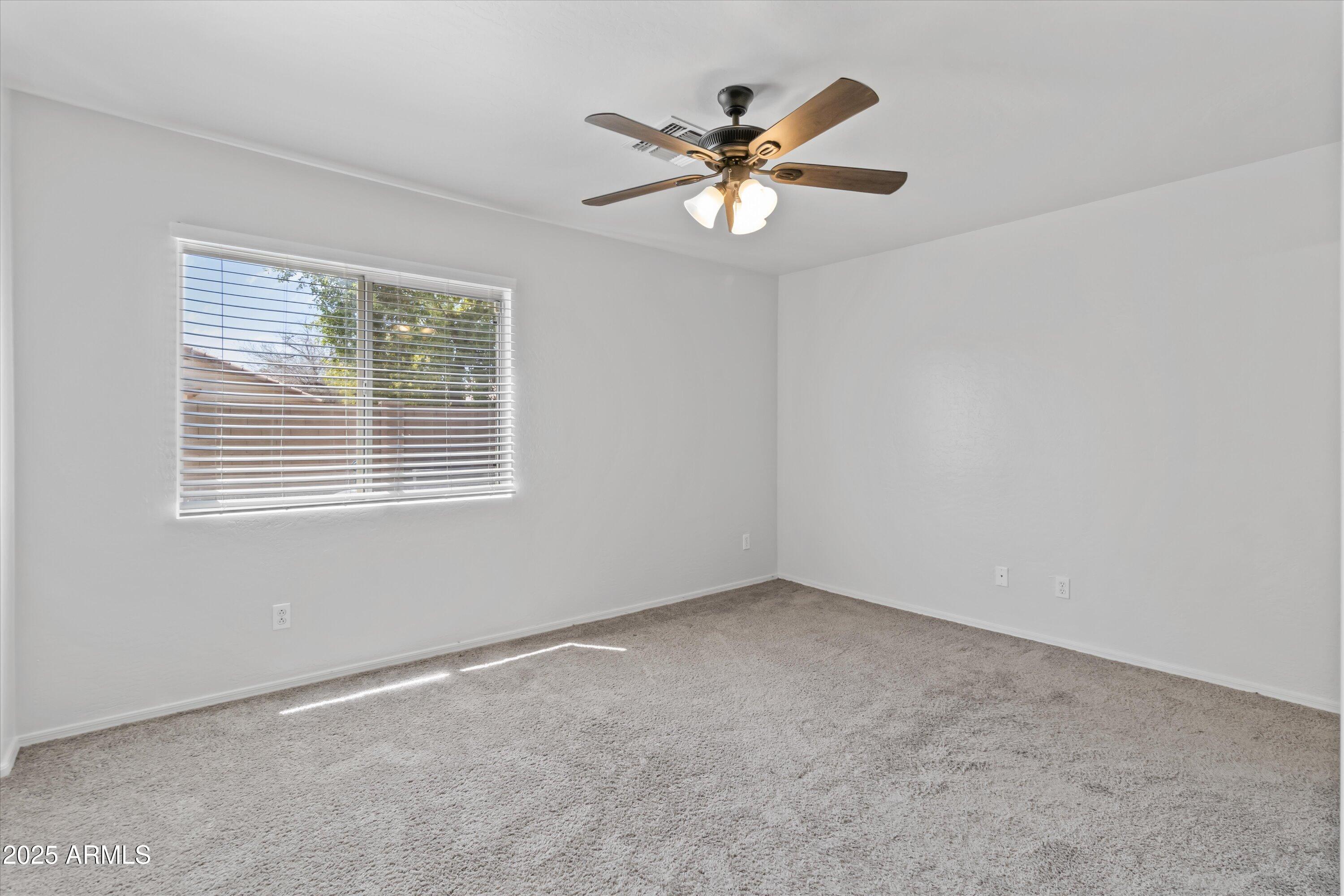 11921 West Bloomfield Road El Mirage, AZ 85335 - Photo 17 of 24 a view of an empty room with a window