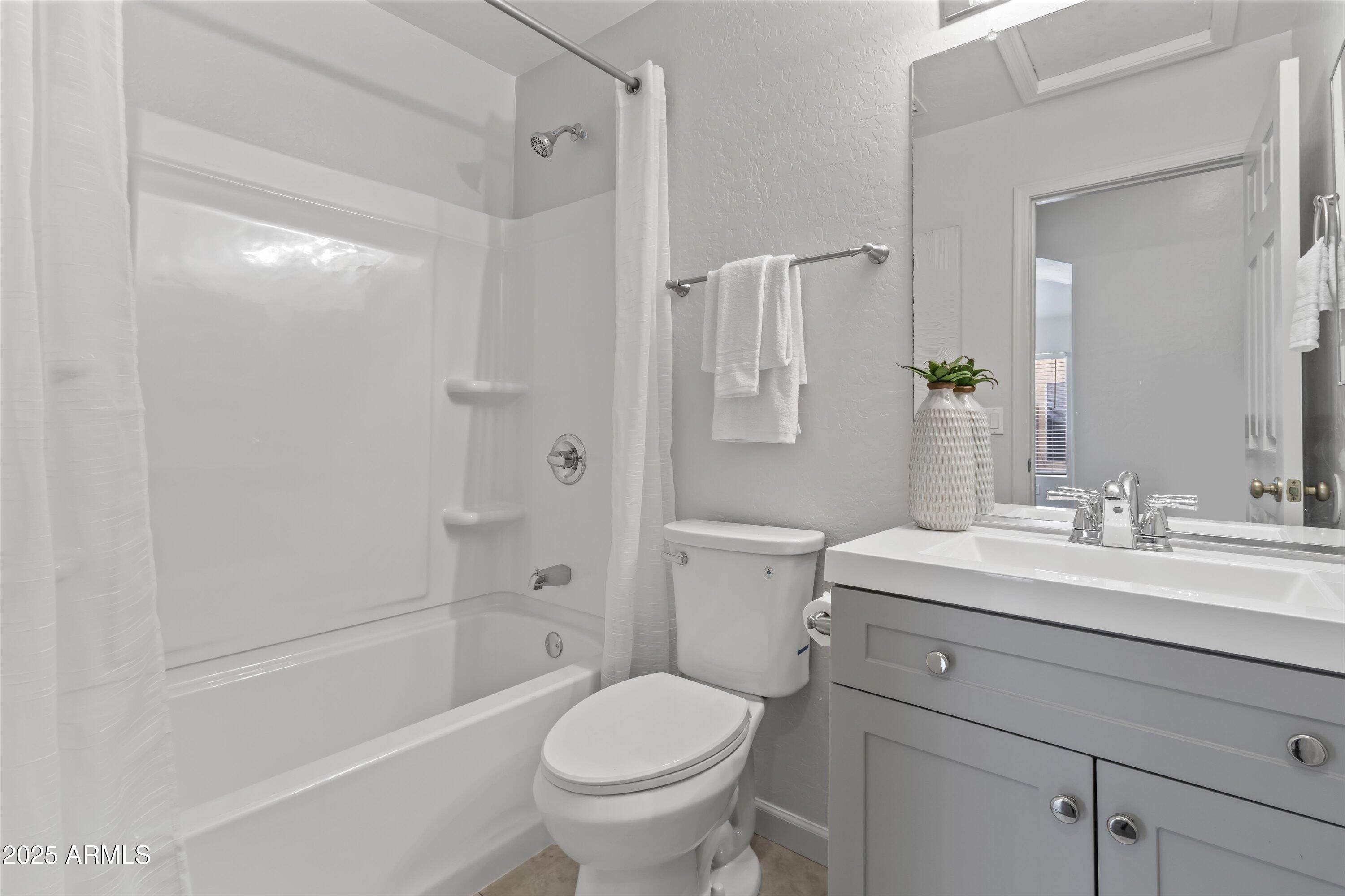 11921 West Bloomfield Road El Mirage, AZ 85335 - Photo 18 of 24 a bathroom with a sink toilet and shower
