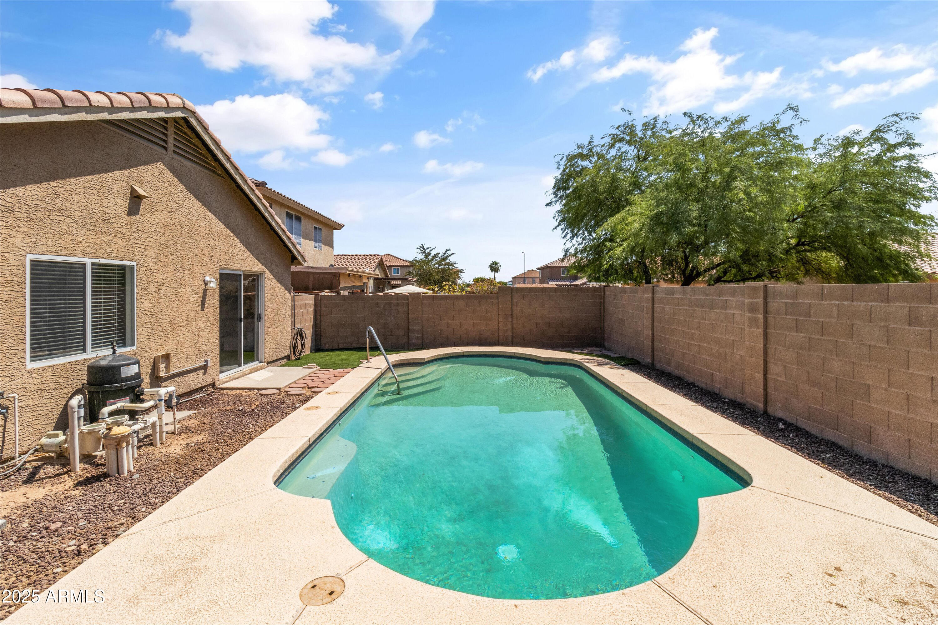 11921 West Bloomfield Road El Mirage, AZ 85335 - Photo 20 of 24 a view of a backyard with swimming pool