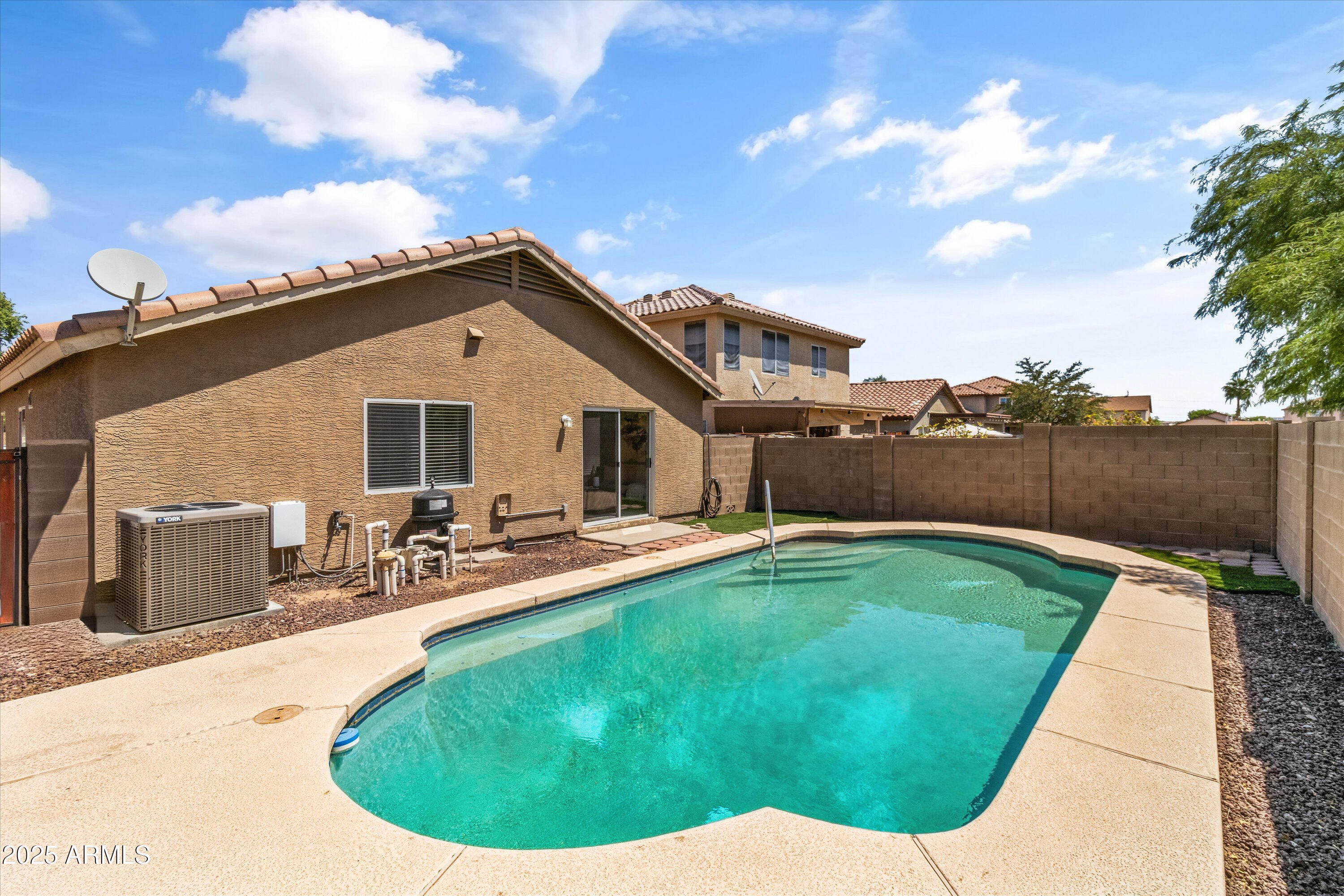 11921 West Bloomfield Road El Mirage, AZ 85335 - Photo 21 of 24 a view of a house with swimming pool