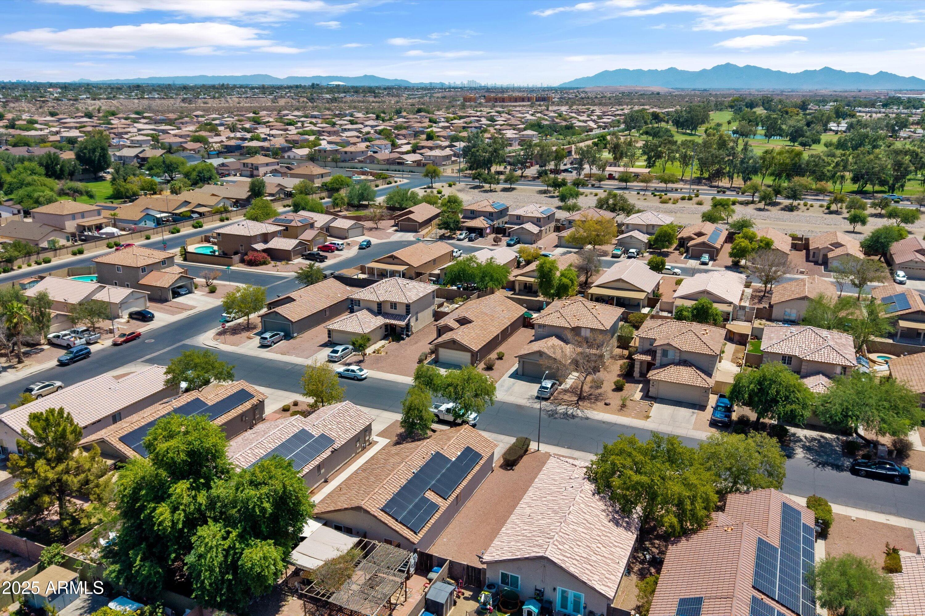11921 West Bloomfield Road El Mirage, AZ 85335 - Photo 22 of 24 an aerial view of a city with lots of residential buildings