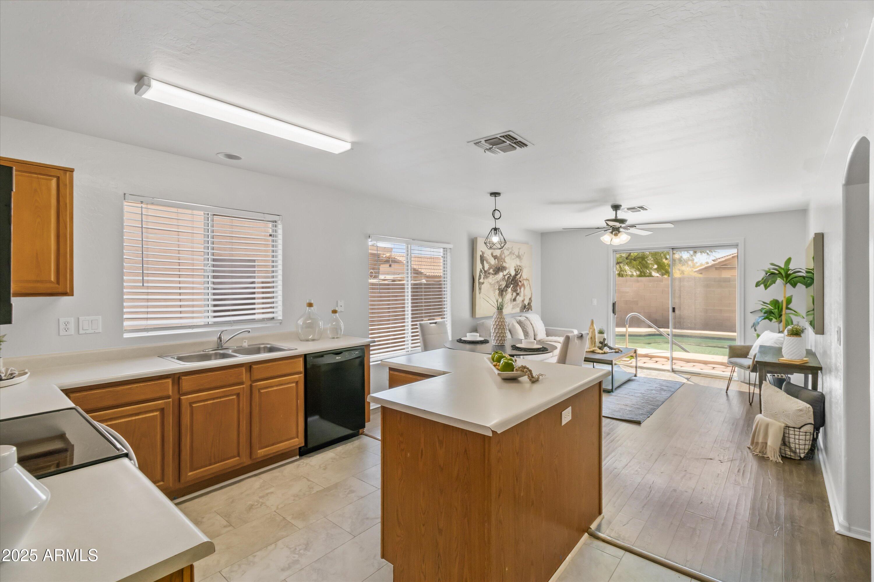 11921 West Bloomfield Road El Mirage, AZ 85335 - Photo 6 of 24 a kitchen with a sink and counter top space