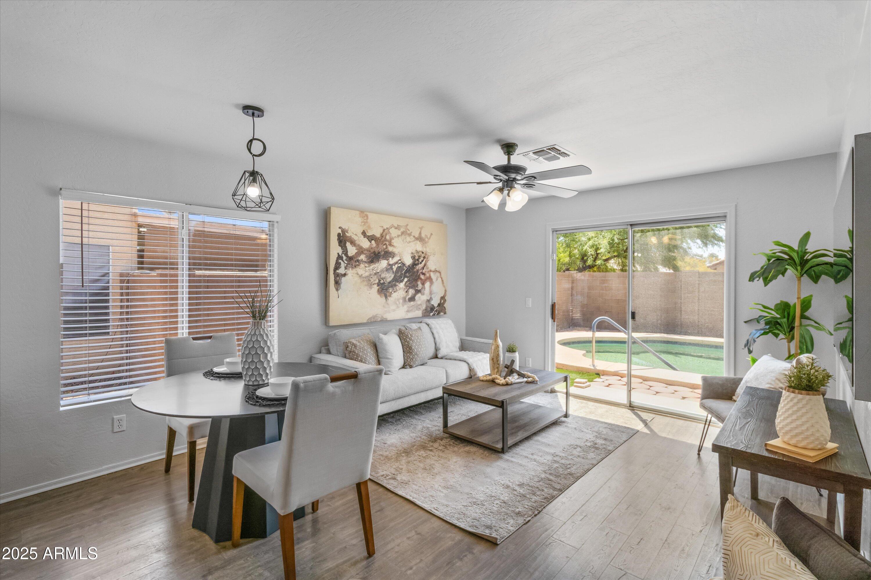 11921 West Bloomfield Road El Mirage, AZ 85335 - Photo 9 of 24 a living room with furniture and a large window
